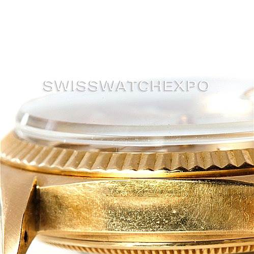 The image shows a close-up side view of the case and bezel of a Rolex President 1803 Men
s Yellow Gold Champagne Dial 1803 Men
s Yellow Gold Champagne Dial model watch.