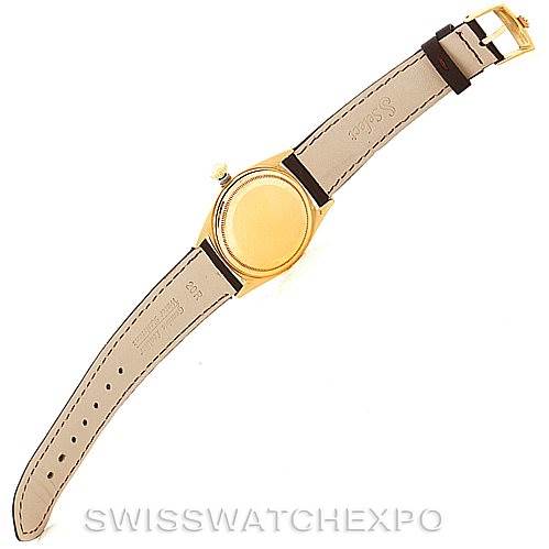 This image shows the backside and strap of a Rolex President 1803 Men
s Yellow Gold Champagne Dial 1803 Men
s Yellow Gold Champagne Dial model watch, with its case back and buckled leather bracelet visible.