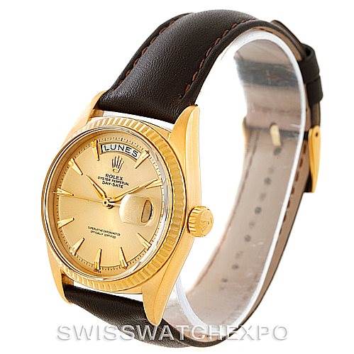 The Rolex President 1803 Men
s Yellow Gold Champagne Dial 1803 Men
s Yellow Gold Champagne Dial model is shown at a three-quarter angle, highlighting its gold case, leather strap, and dial with a day and date display.