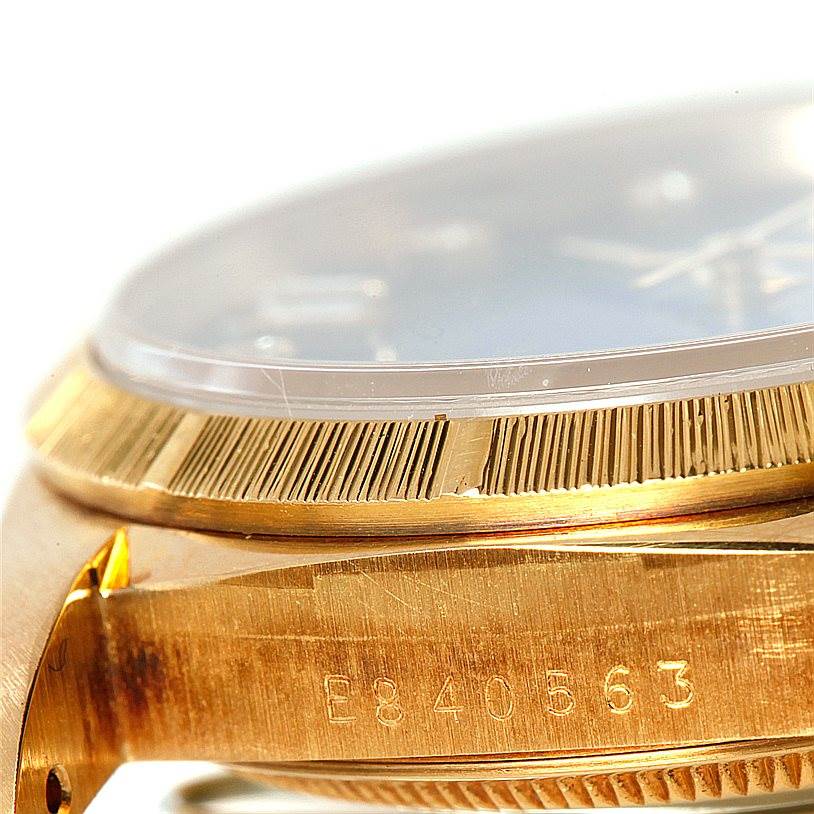 The image shows a close-up side angle of the Rolex President 18248 Men's Yellow Gold Blue Dial 18248 Men's Yellow Gold Blue Dial model watch, highlighting its bezel and case.