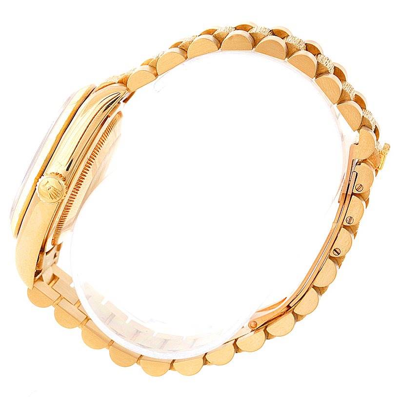 The image shows a side view of the Rolex President 18248 Men's Yellow Gold Blue Dial 18248 Men's Yellow Gold Blue Dial model watch, focusing on the bracelet and the crown.