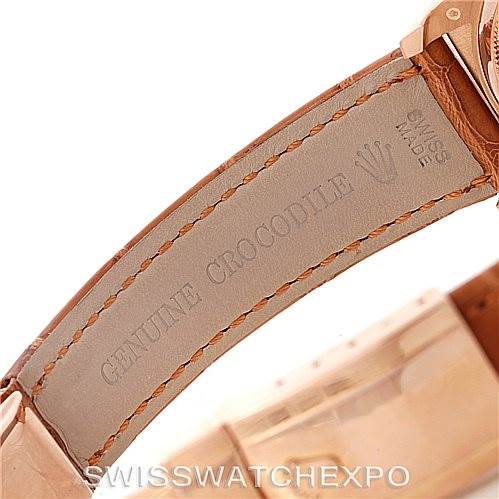 This image shows a close-up of the leather strap of a Rolex President 116185 Men's Rose Gold Mother of Pearl Dial 116185 Men's Rose Gold Mother of Pearl Dial model watch, highlighting the stitching and "GENUINE CROCODILE" imprint.