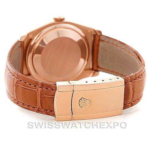 The image shows the back case and leather strap with a clasp of a Rolex President 116185 Men's Rose Gold Mother of Pearl Dial 116185 Men's Rose Gold Mother of Pearl Dial model watch.