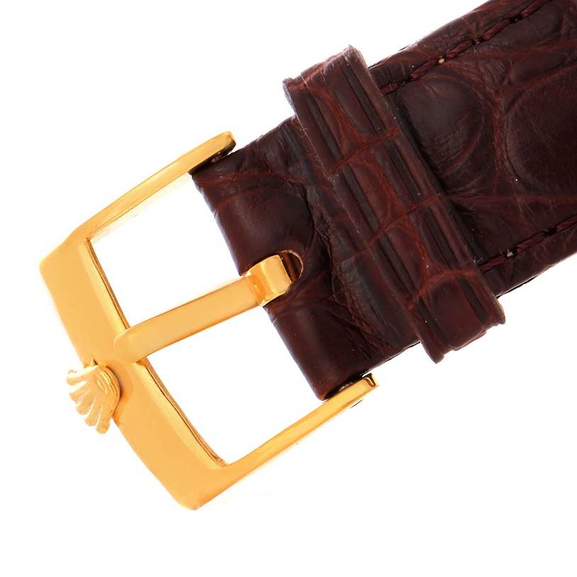 This image shows a close-up of the leather strap and gold buckle of a Rolex President 1503 Men
s Yellow Gold Champagne Dial 1503 Men
s Yellow Gold Champagne Dial watch.