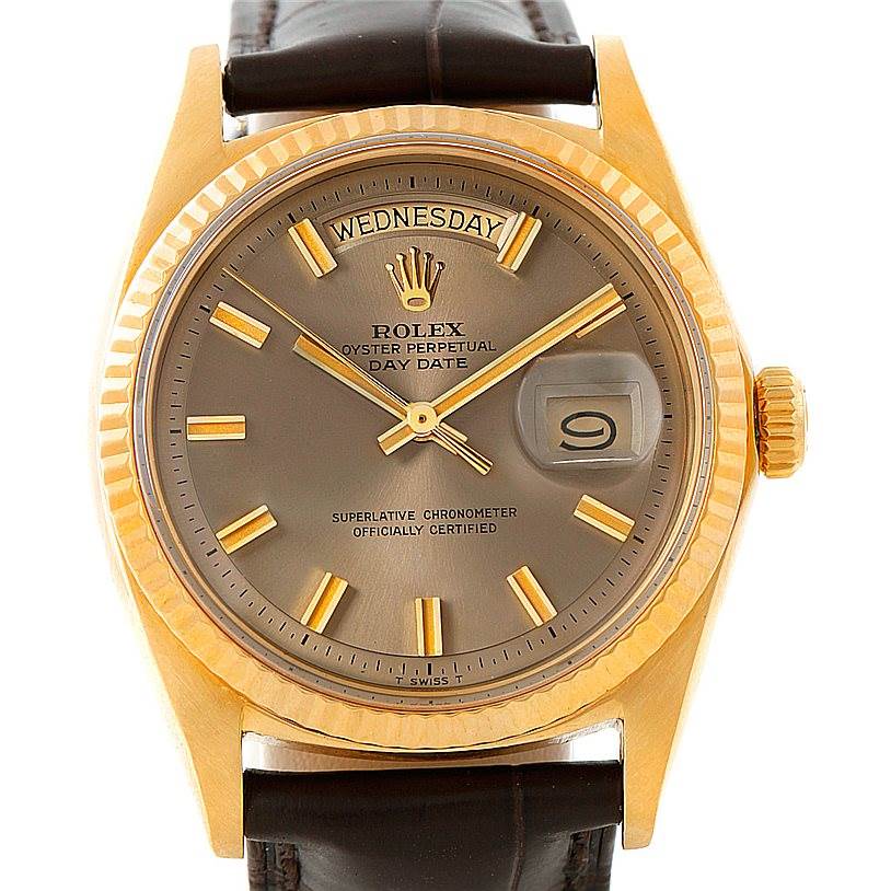This image depicts a Rolex President 1803 Men's Yellow Gold Brown Dial 1803 Men's Yellow Gold Brown Dial model with a gold-tone case, grey dial, and day-date display, viewed from the front.