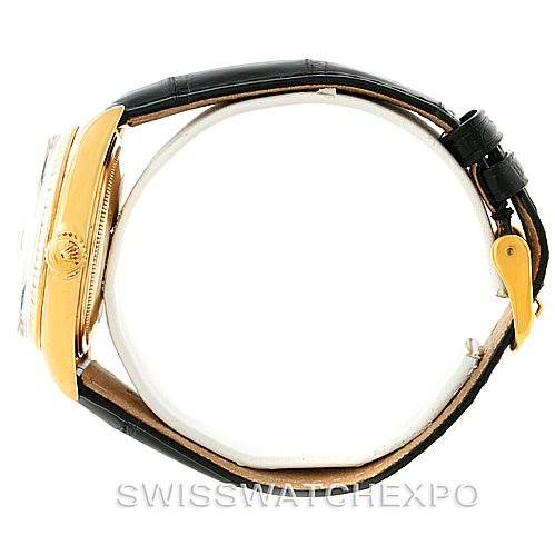 The image shows a side view of a Rolex President 1803 Men
s Yellow Gold Black Dial 1803 Men
s Yellow Gold Black Dial watch, highlighting the case, crown, bezel, and leather strap.