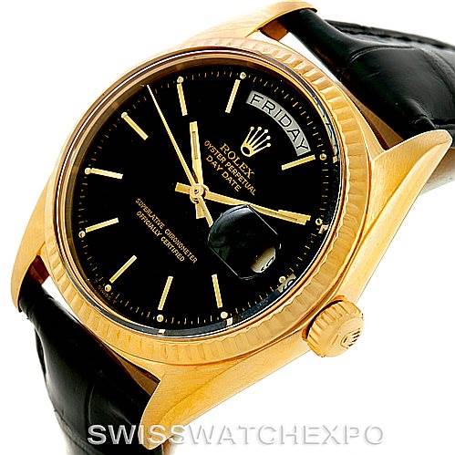 This is a Rolex President 1803 Men
s Yellow Gold Black Dial 1803 Men
s Yellow Gold Black Dial model watch shown from an angled side view, displaying the watch face, crown, and leather strap.