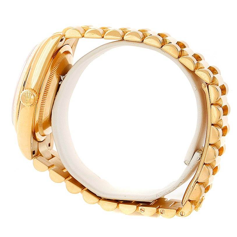 The image shows a side view of a gold Rolex President 118238 Men's Yellow Gold Beige Dial 118238 Men's Yellow Gold Beige Dial model watch, highlighting its band and crown.