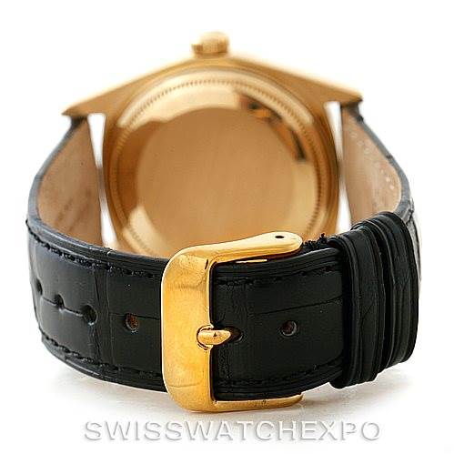 The image shows the back of a Rolex President 18038 Men's Yellow Gold Black Dial 18038 Men's Yellow Gold Black Dial model watch with a black leather strap and gold buckle.
