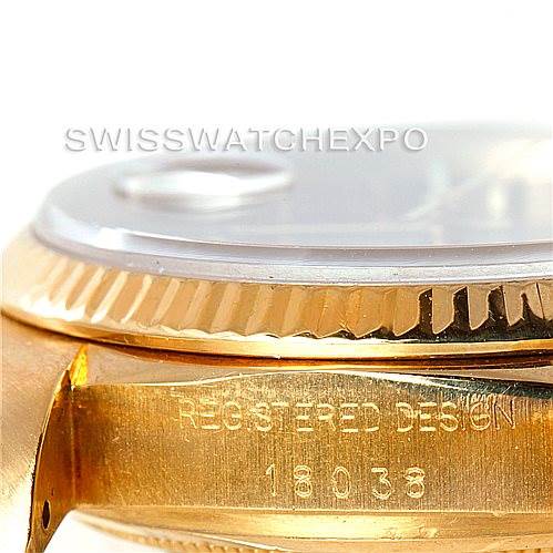 This close-up image of a Rolex President 18038 Men's Yellow Gold Black Dial 18038 Men's Yellow Gold Black Dial model shows the watch's side, focusing on the bezel and the engraved model number "18038".