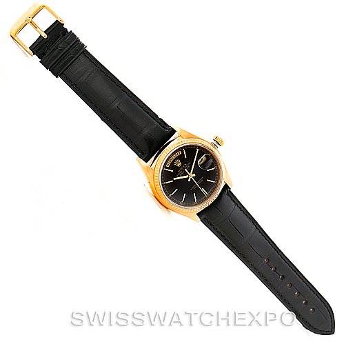 The image shows a Rolex President 18038 Men's Yellow Gold Black Dial 18038 Men's Yellow Gold Black Dial model watch laid flat, displaying the face, black leather strap, and gold buckle.