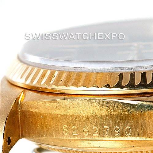 This image shows a close-up side view of a Rolex President 18038 Men's Yellow Gold Black Dial 18038 Men's Yellow Gold Black Dial model watch, highlighting the serial number, case, and bezel.