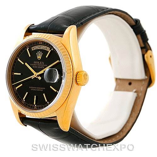 The image shows a side angle of a Rolex President 18038 Men's Yellow Gold Black Dial 18038 Men's Yellow Gold Black Dial watch, highlighting its black leather strap, gold case, and dial with day-date display.