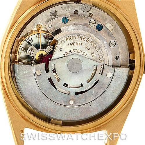 The image shows the internal mechanism of a Rolex President 1601 Men
s Yellow Gold Champagne Dial 1601 Men
s Yellow Gold Champagne Dial model watch, including its movement and various gears.