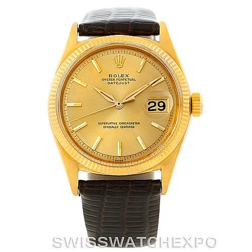 The image shows a front view of the Rolex President 1601 Men
s Yellow Gold Champagne Dial 1601 Men
s Yellow Gold Champagne Dial Oyster Perpetual Datejust watch, displaying its face, date window, and leather strap.