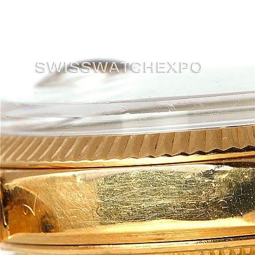 This close-up image of the Rolex President 1601 Men
s Yellow Gold Champagne Dial 1601 Men
s Yellow Gold Champagne Dial model watch shows the side view of the bezel and part of the case.
