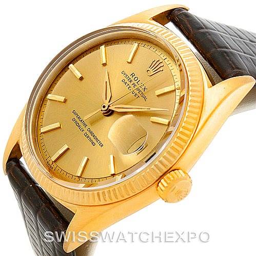 This image shows a side angle of the Rolex President 1601 Men
s Yellow Gold Champagne Dial 1601 Men
s Yellow Gold Champagne Dial model, highlighting the dial, bezel, crown, and a portion of the leather strap.