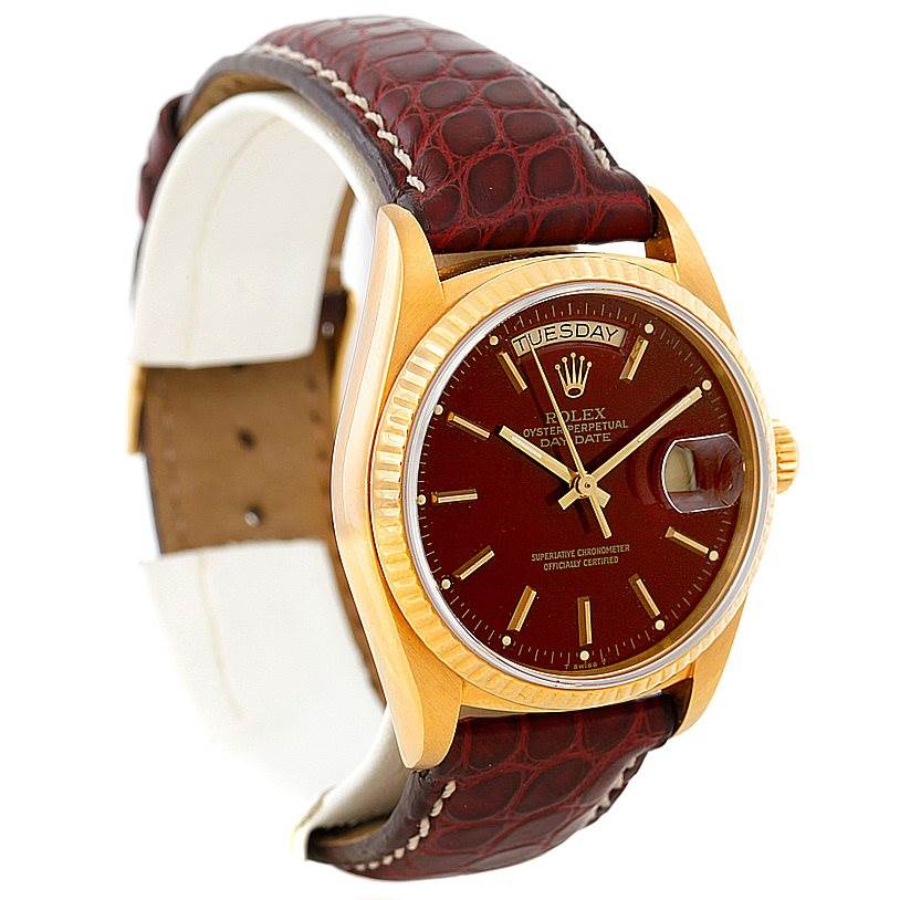 This image shows a Rolex President 18038 Men
s Yellow Gold Champagne Dial 18038 Men
s Yellow Gold Champagne Dial model watch at a slight angle, displaying its dial, bezel, and brown leather strap.