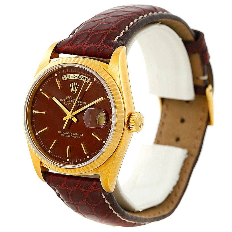 This image shows a front angle of a Rolex President 18038 Men
s Yellow Gold Champagne Dial 18038 Men
s Yellow Gold Champagne Dial model watch, highlighting the dial, bezel, crown, and leather strap.