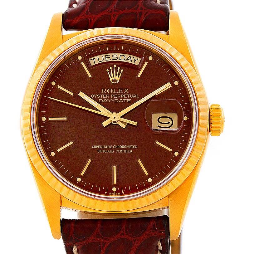 This image shows a Rolex President 18038 Men
s Yellow Gold Champagne Dial 18038 Men
s Yellow Gold Champagne Dial model watch from a front angle highlighting its gold case, brown dial, and day-date display.