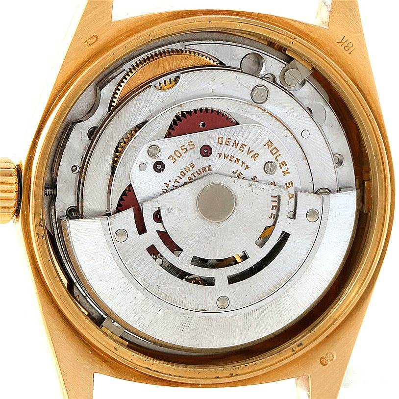 The image shows the internal movement mechanism of the Rolex President 18038 Men
s Yellow Gold Champagne Dial 18038 Men
s Yellow Gold Champagne Dial model from the back angle, revealing gears and the rotor.
