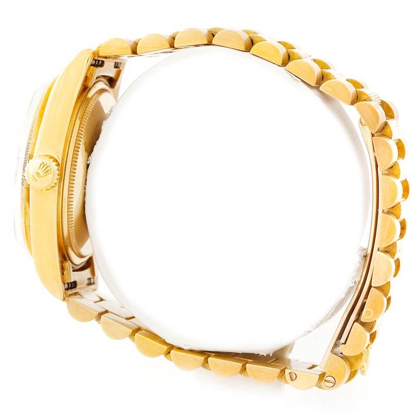 The image shows a side view of the Rolex President 1807 Men
s Yellow Gold Silver Dial 1807 Men
s Yellow Gold Silver Dial model watch, highlighting its gold crown, case, and bracelet.