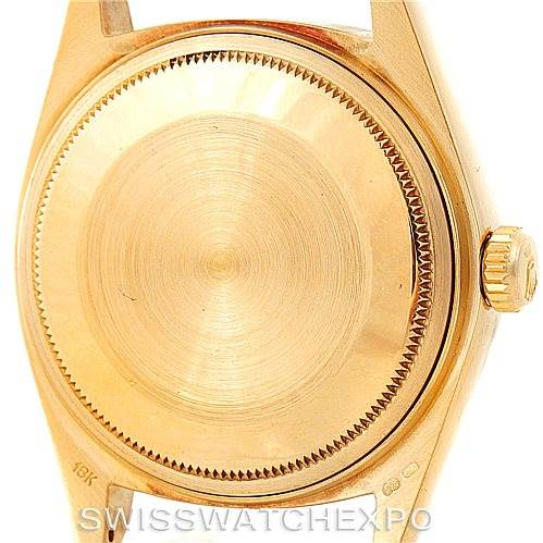This image shows the back case and crown of a Rolex President 18038 Men's Yellow Gold Black Dial 18038 Men's Yellow Gold Black Dial model watch.