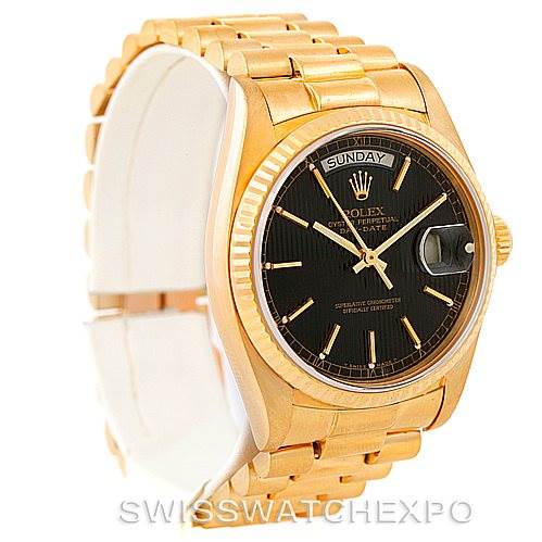 This image shows a President model by Rolex from an angled side view, highlighting its black dial, day-date feature, and gold bracelet.