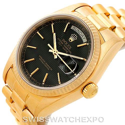 This image shows the Rolex President 18038 Men's Yellow Gold Black Dial 18038 Men's Yellow Gold Black Dial model watch at a slight angle, highlighting its gold case, black dial, day-date window, and bracelet.