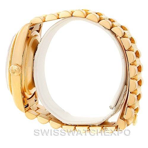 The image shows a side profile of the Rolex President 18248 Men's Yellow Gold Blue Dial 18248 Men's Yellow Gold Blue Dial model, highlighting the crown, bezel, and part of the bracelet.