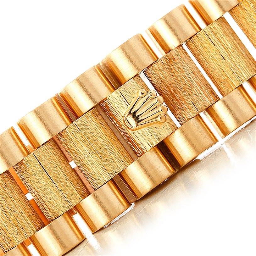 The image shows a close-up of the bracelet links of a Rolex President 18248 Men
s Yellow Gold Champagne Dial 18248 Men
s Yellow Gold Champagne Dial model watch.