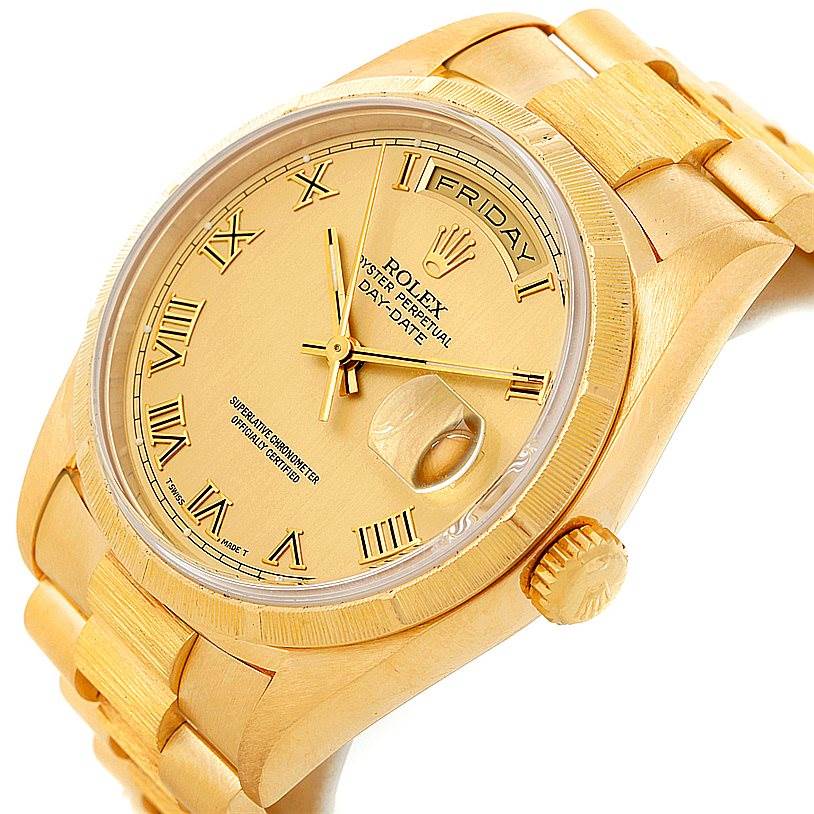 The image shows a close-up angle of the Rolex President 18248 Men
s Yellow Gold Champagne Dial 18248 Men
s Yellow Gold Champagne Dial model watch, highlighting the dial, bezel, crown, and a part of the bracelet.