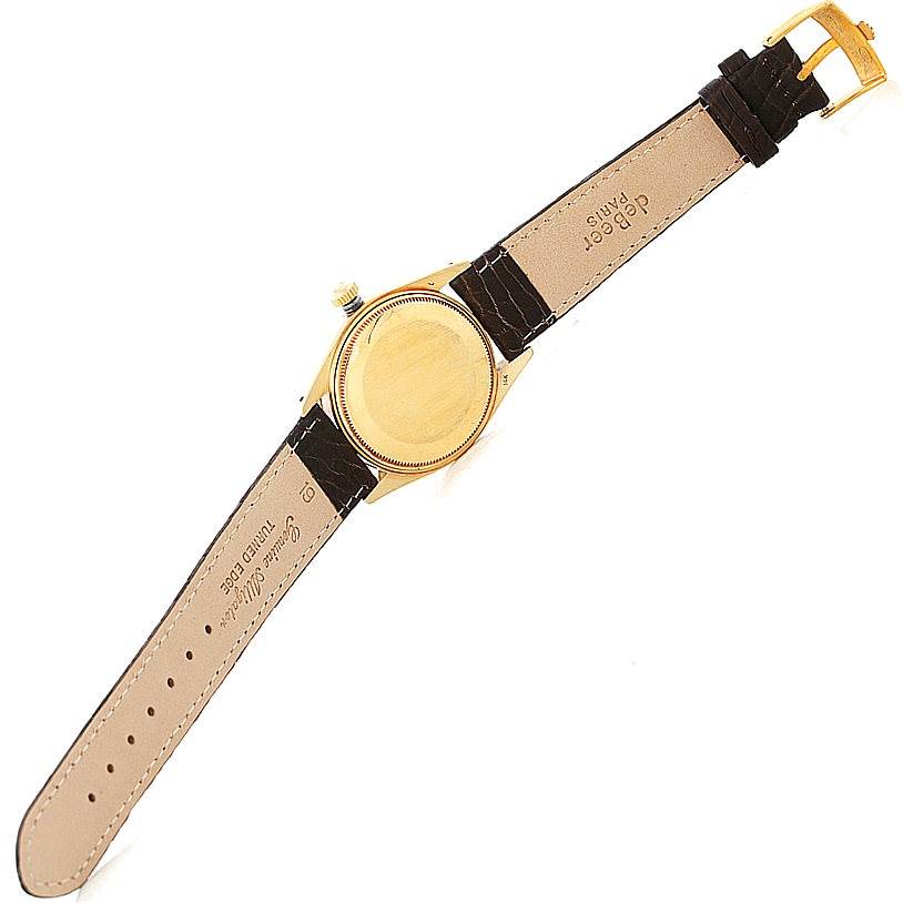 The image shows the underside of the Rolex President 1503 Men
s Yellow Gold Silver Dial 1503 Men
s Yellow Gold Silver Dial watch with the leather strap and Clasp visible.