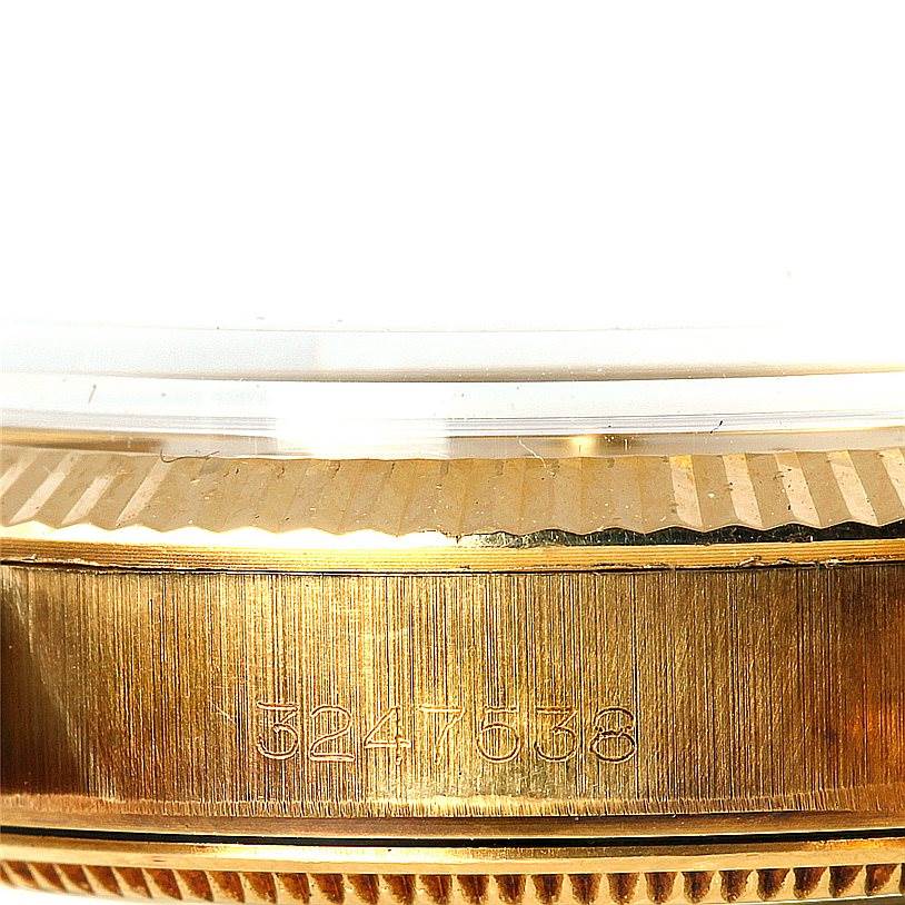 The image shows a close-up side view of the Rolex President 1503 Men
s Yellow Gold Silver Dial 1503 Men
s Yellow Gold Silver Dial model, focusing on the bezel and serial number.