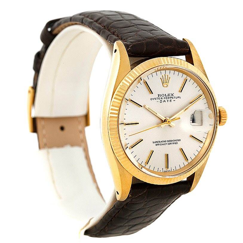 The image shows a side-angle view of a Rolex President 1503 Men
s Yellow Gold Silver Dial 1503 Men
s Yellow Gold Silver Dial watch, highlighting the face, bezel, crown, and leather strap.