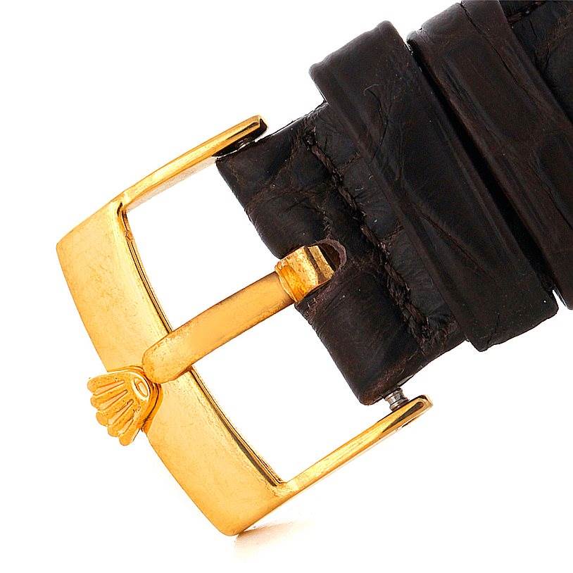 The image shows the clasp and part of the leather strap of a Rolex President 1503 Men
s Yellow Gold Silver Dial 1503 Men
s Yellow Gold Silver Dial model watch.