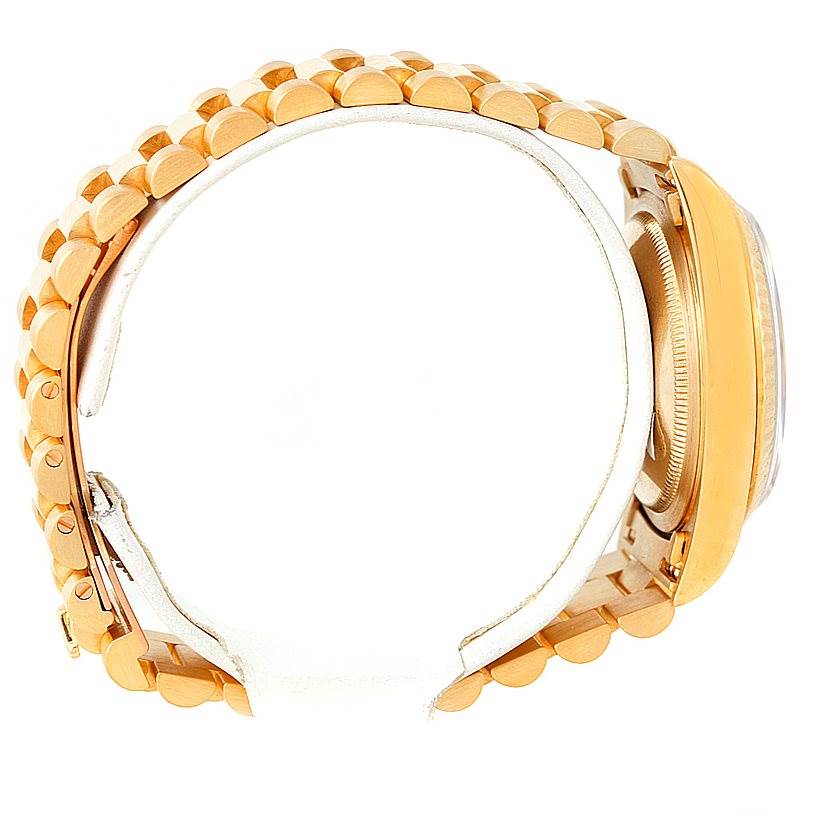 The image shows the side view of a Rolex President 18238 Men
s Yellow Gold Champagne Dial 18238 Men
s Yellow Gold Champagne Dial model watch, highlighting its gold bracelet and bezel.