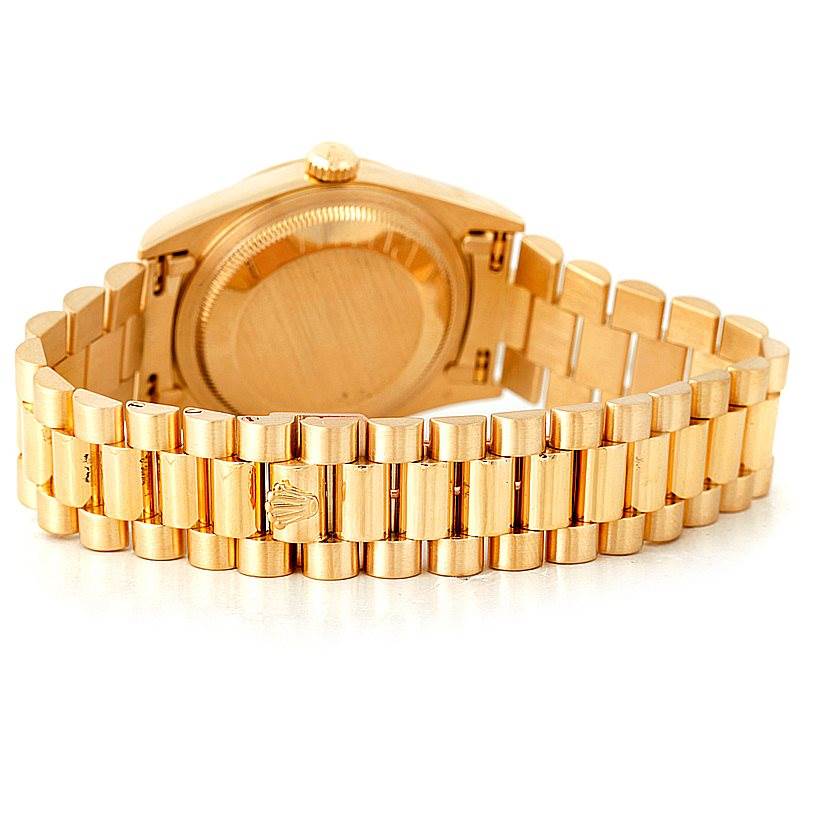 This image shows the back and bracelet of a gold Rolex President 18238 Men
s Yellow Gold Champagne Dial 18238 Men
s Yellow Gold Champagne Dial model watch, with the case back and clasp visible.