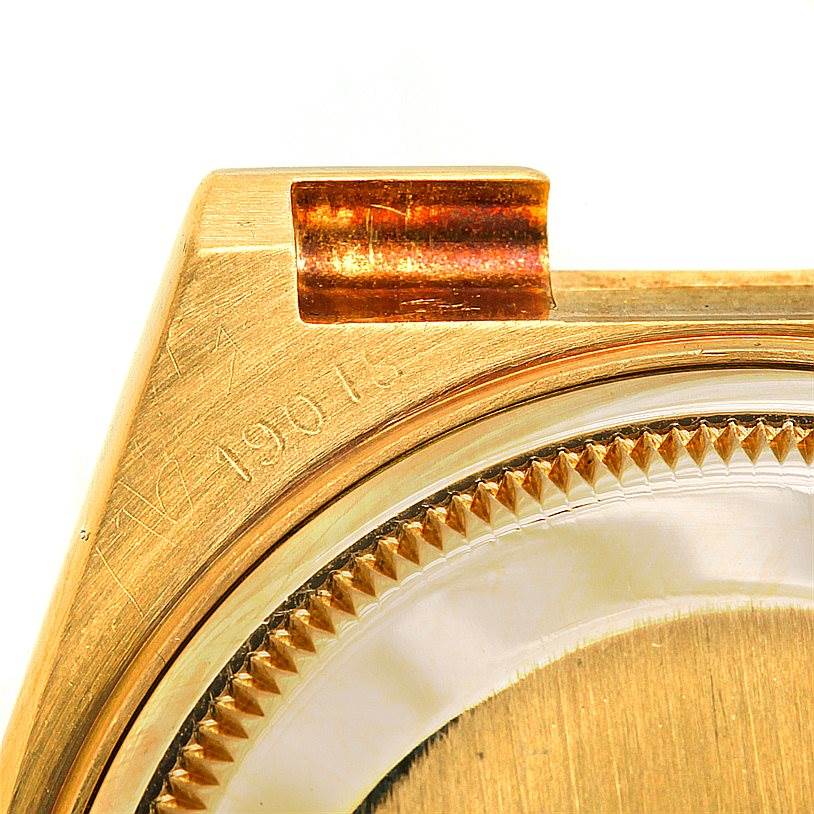 This image shows a detailed view of the case and bezel of the Rolex President 19000 Men
s Yellow Gold Champagne Dial 19000 Men
s Yellow Gold Champagne Dial model watch.