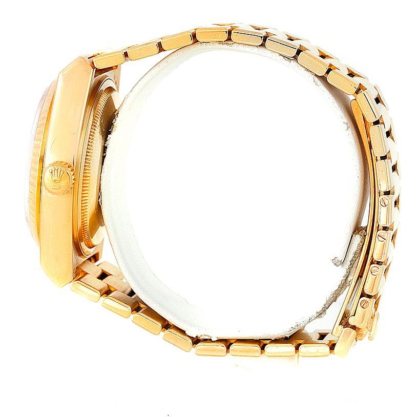 The image shows a side view of the Rolex President 19000 Men
s Yellow Gold Champagne Dial 19000 Men
s Yellow Gold Champagne Dial watch, focusing on the case, crown, and part of the bracelet.