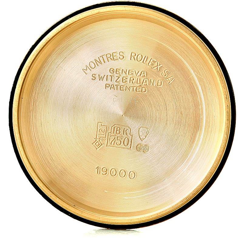 This image shows the interior case back of a Rolex President 19000 Men
s Yellow Gold Champagne Dial 19000 Men
s Yellow Gold Champagne Dial model watch, displaying engravings and gold purity marks.