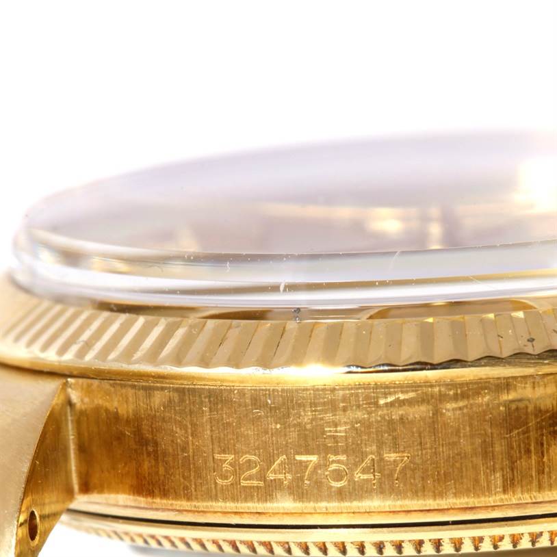 This image shows a close-up side view of the case wall, bezel, and crystal of a Rolex President 1503 Men
s Yellow Gold Champagne Dial 1503 Men
s Yellow Gold Champagne Dial watch, including the serial number.