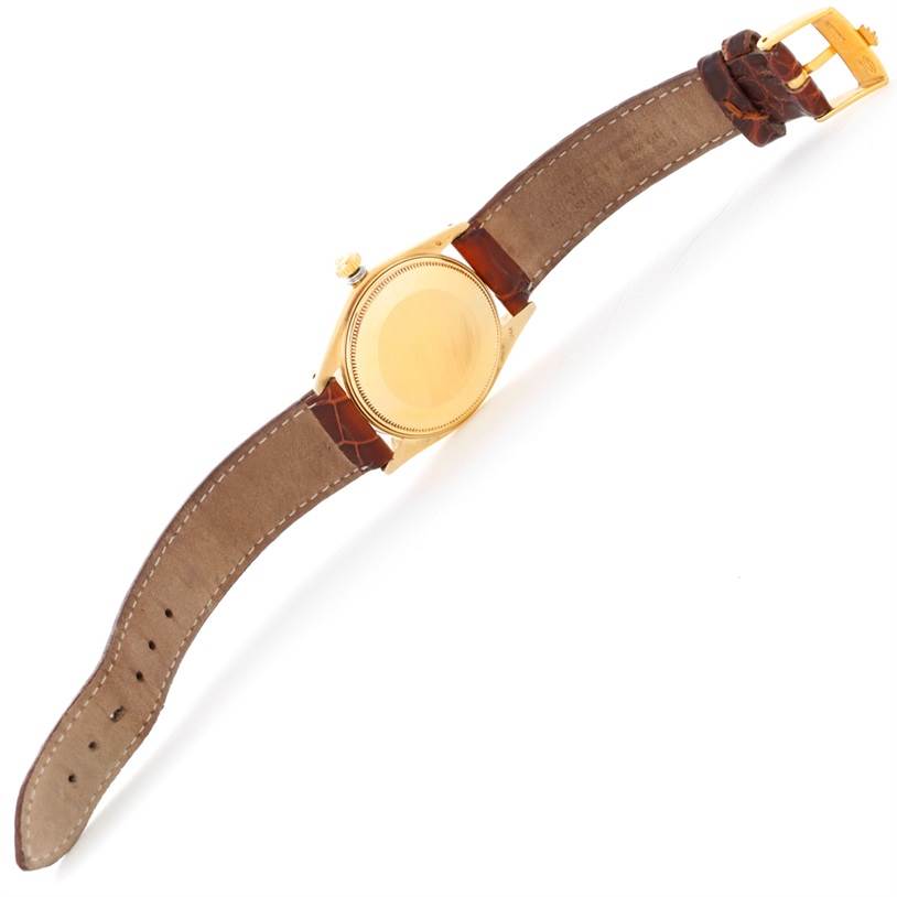 This image shows the back and leather strap of a Rolex President 1503 Men
s Yellow Gold Champagne Dial 1503 Men
s Yellow Gold Champagne Dial model watch.