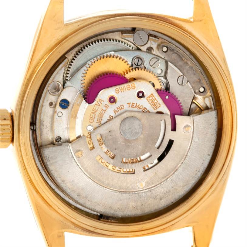 The image shows the internal mechanics and movement of a Rolex President 1803 Men
s Yellow Gold Silver Dial 1803 Men
s Yellow Gold Silver Dial model watch from a rear angle.