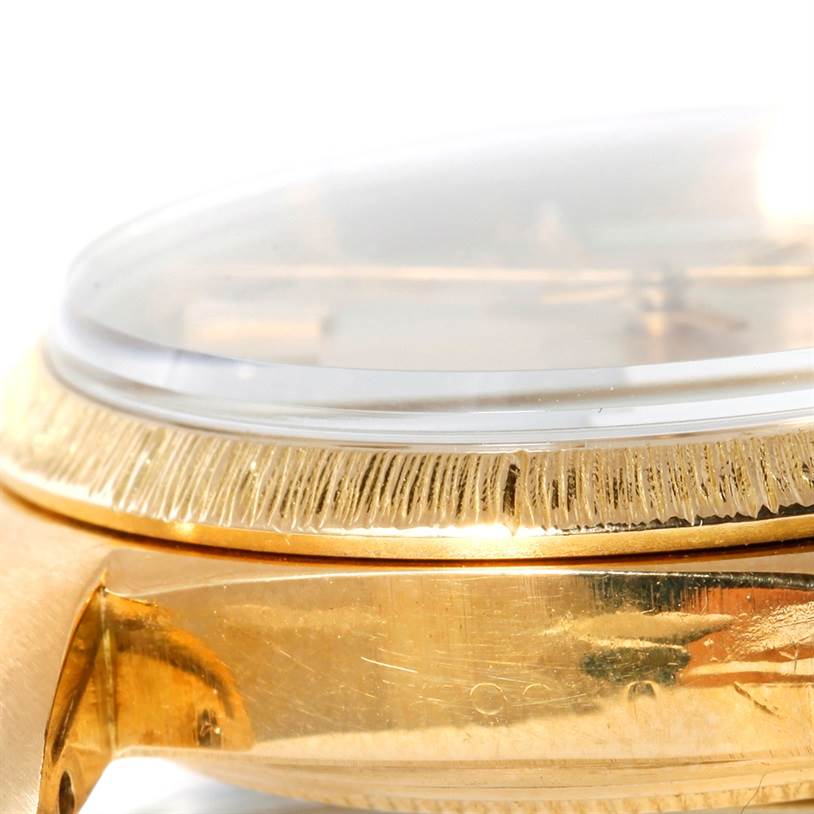 The image shows a close-up side view of the Rolex President 1803 Men
s Yellow Gold Silver Dial 1803 Men
s Yellow Gold Silver Dial model watch, focusing on its gold case and fluted bezel.