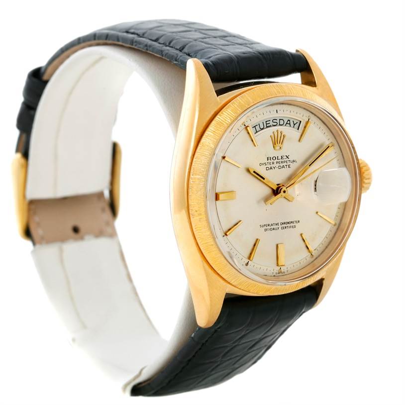 This image shows a Rolex President 1803 Men
s Yellow Gold Silver Dial 1803 Men
s Yellow Gold Silver Dial model watch at an angled side view, revealing the dial, case, crown, and leather strap.