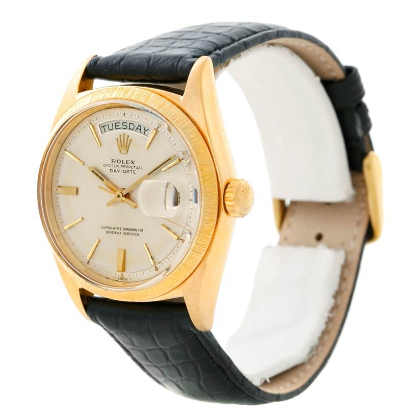 The Rolex President 1803 Men
s Yellow Gold Silver Dial 1803 Men
s Yellow Gold Silver Dial model watch is shown at a three-quarter angle, highlighting the gold case, dial, crown, and black leather strap.