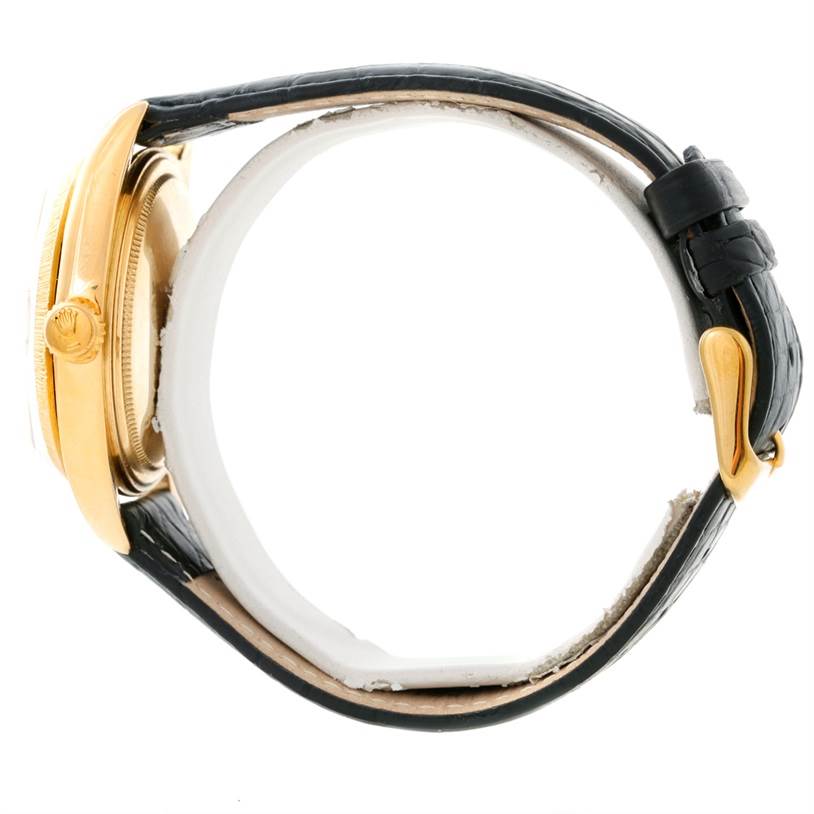 The image shows a side profile of the Rolex President 1803 Men
s Yellow Gold Silver Dial 1803 Men
s Yellow Gold Silver Dial model watch, highlighting its gold case, crown, and leather strap with a buckle.