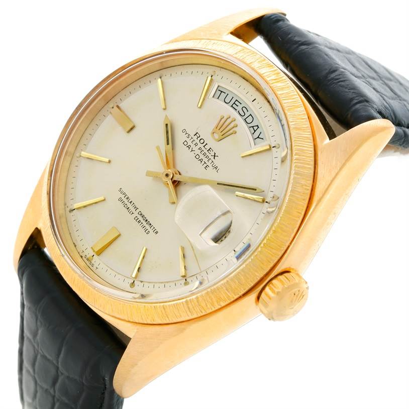 This image shows a close-up view of the dial, case, and crown of a Rolex President 1803 Men
s Yellow Gold Silver Dial 1803 Men
s Yellow Gold Silver Dial model watch with a black leather strap.