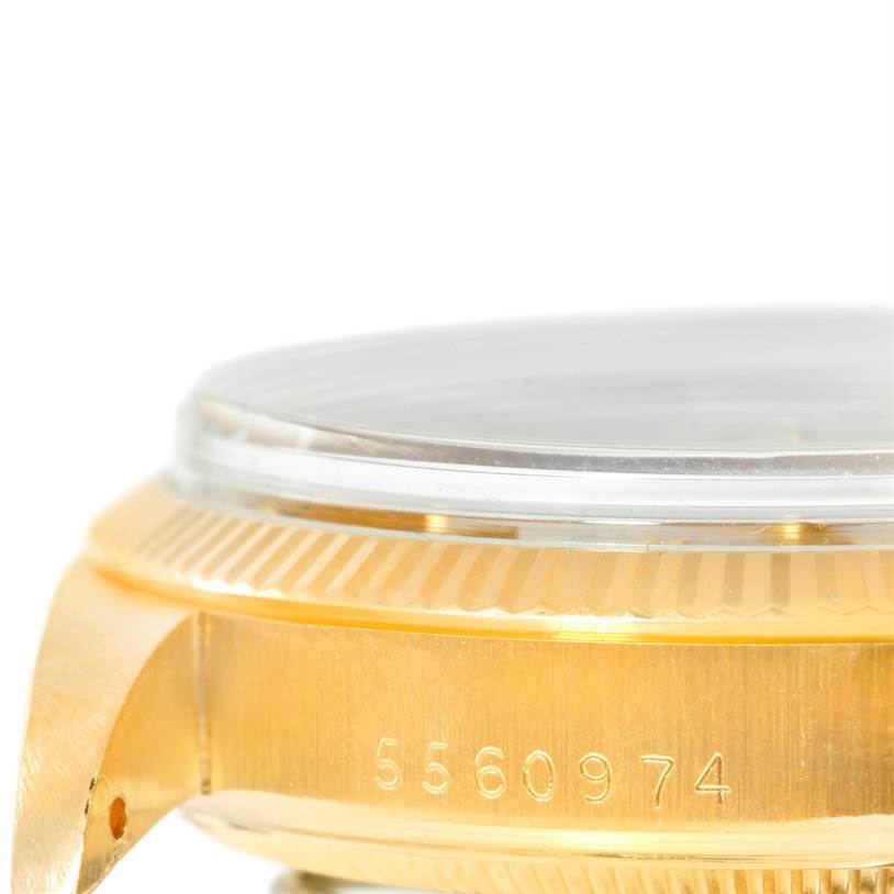 This image shows a close-up side view of the case and bezel with the serial number on a Rolex President 1503 Men
s Yellow Gold Silver Dial 1503 Men
s Yellow Gold Silver Dial watch.